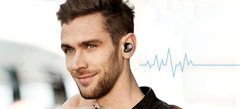 a man wearing heart rate monitor earbuds