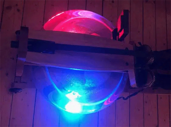 blue and pink lights in the water tank of a rowing machine