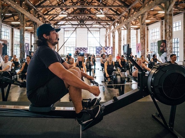 people rowing together indoor