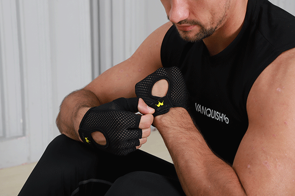 a man wears a pair of Topiom rowing gloves
