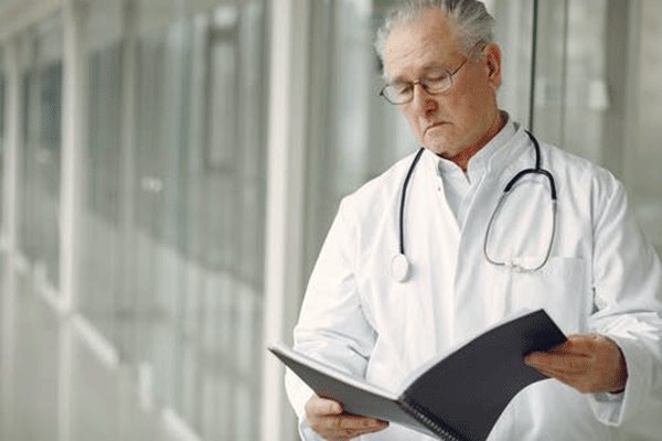 a doctor reading medical records