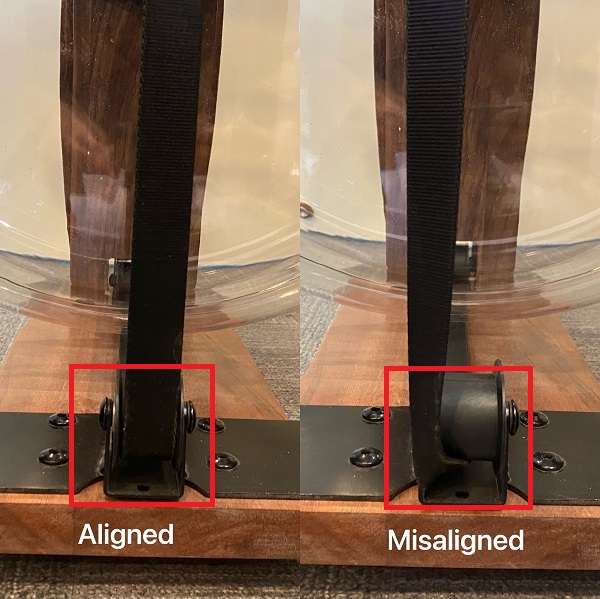 one belt aligned around the front pulley and another belt derailed from the front pulley