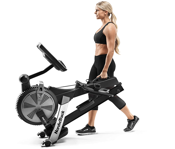 A woman rows with nordictrack rw500 rowing machine