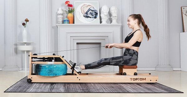 a woman rowing with Topiom rowing machine