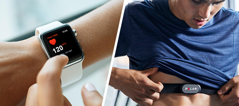 a finger points at the heart rate monitoring interface of a iwatch and a man wearing blue clothes looks at chest strap heart rate monitor