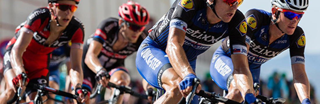 four cyclists riding bikes