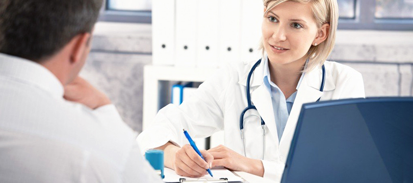 a man and a woman consult a doctor